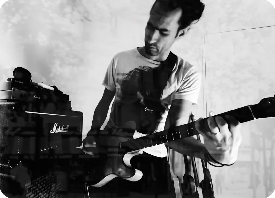 Dektri playing a tele in front of a Marshall stack